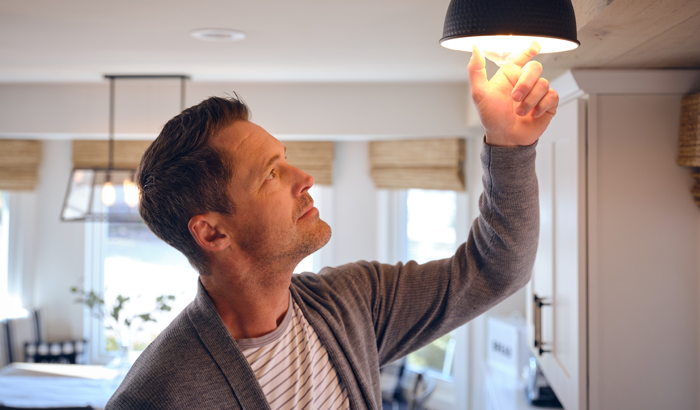 man installing light