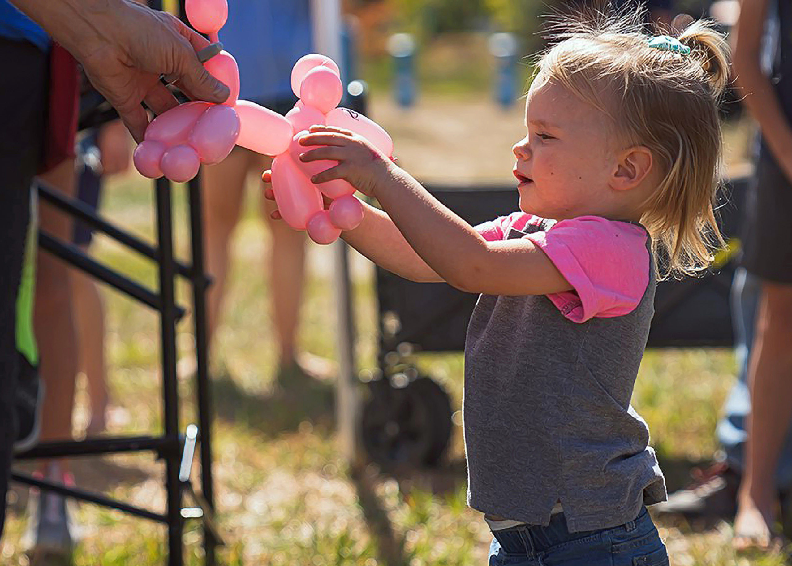 child holding balloon