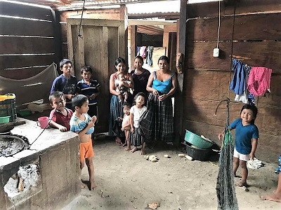 Family inside of their home in Pie del Cerro.