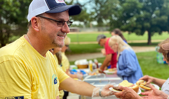 Community member handing out food