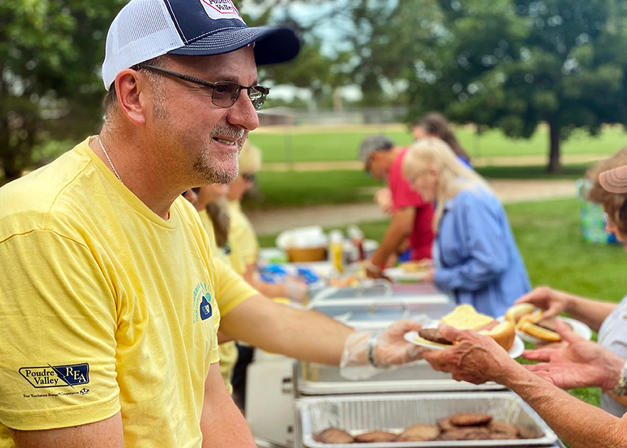 Community member handing out food