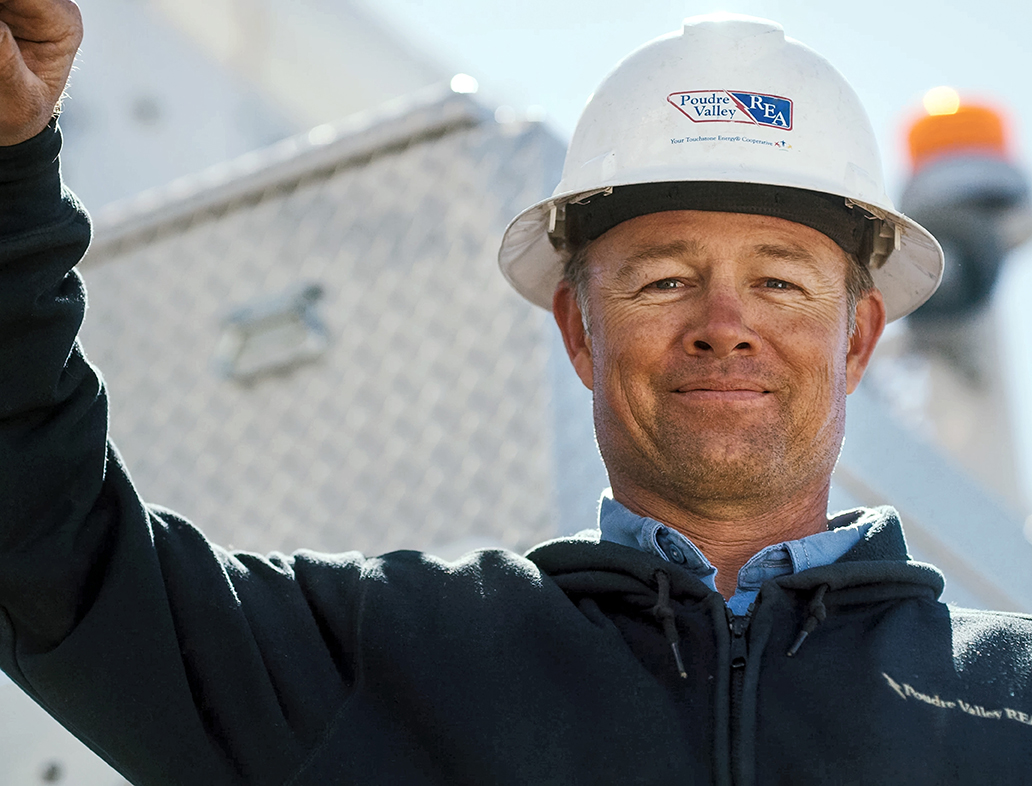 smiling PVREA employee with hard hat