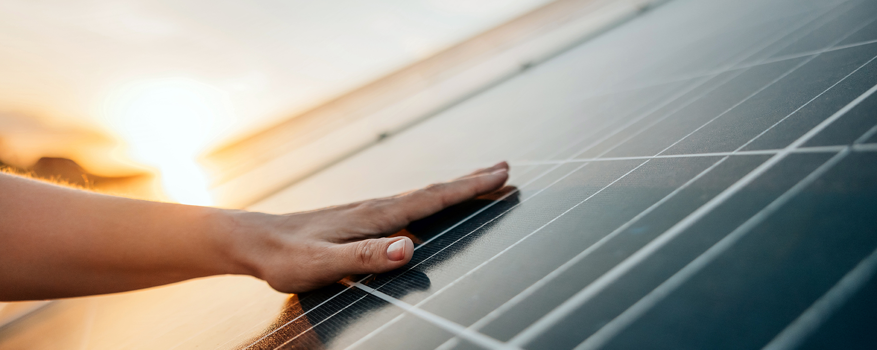 hand on solar panel