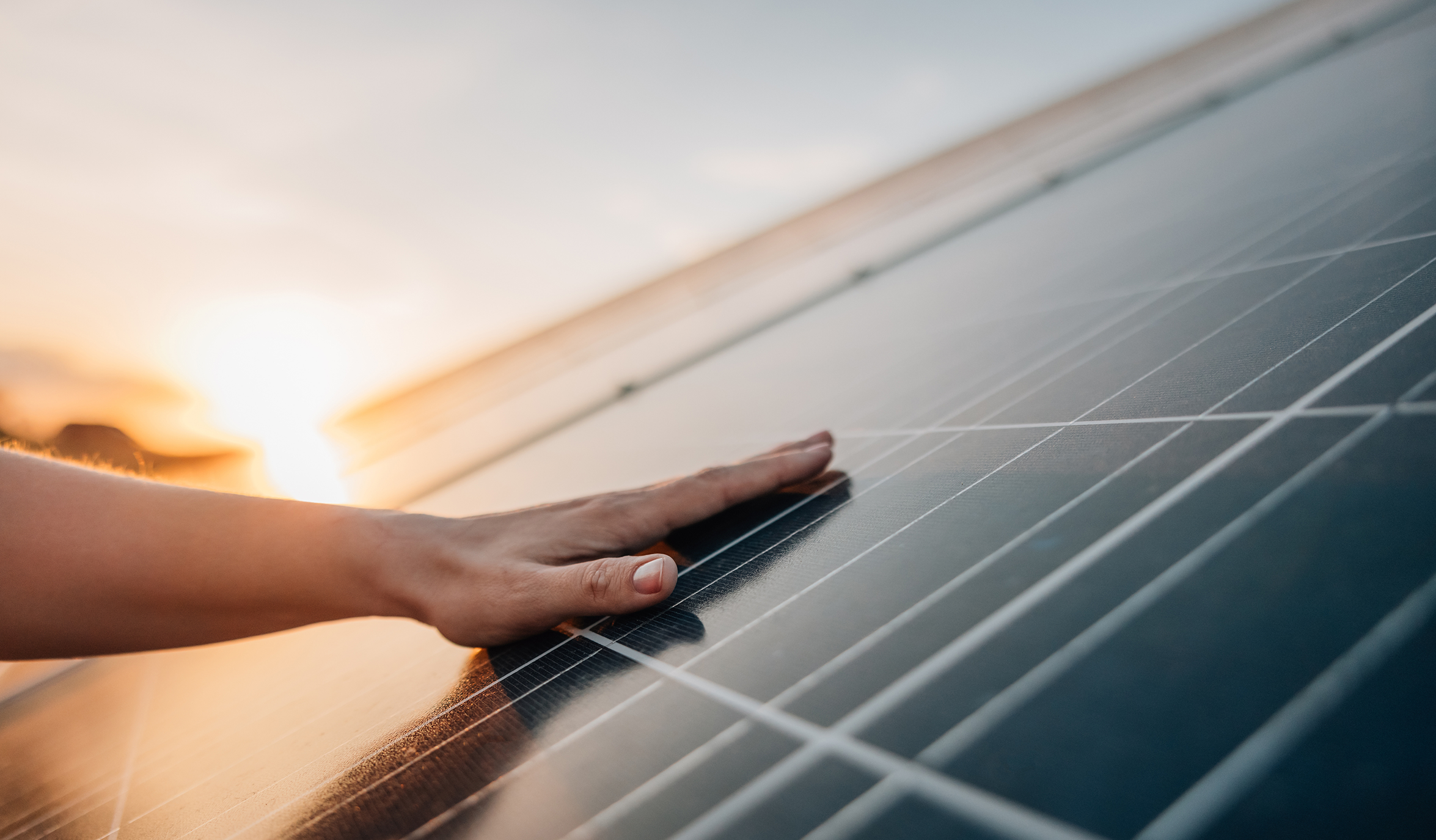 Low to Moderate Income Assistance Program - Hand On Solar Panel