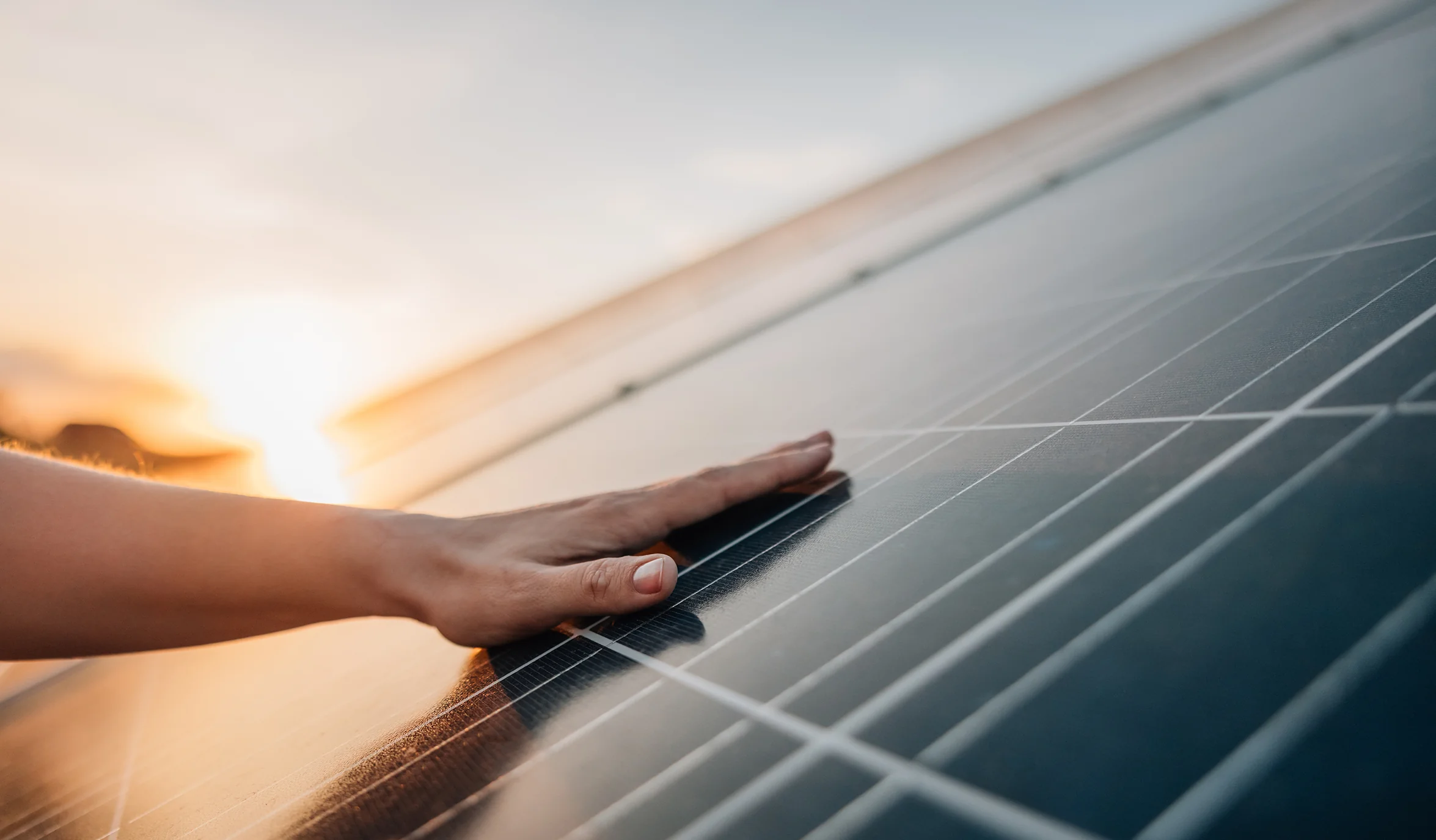 Low to Moderate Income Assistance Program - Hand On Solar Panel