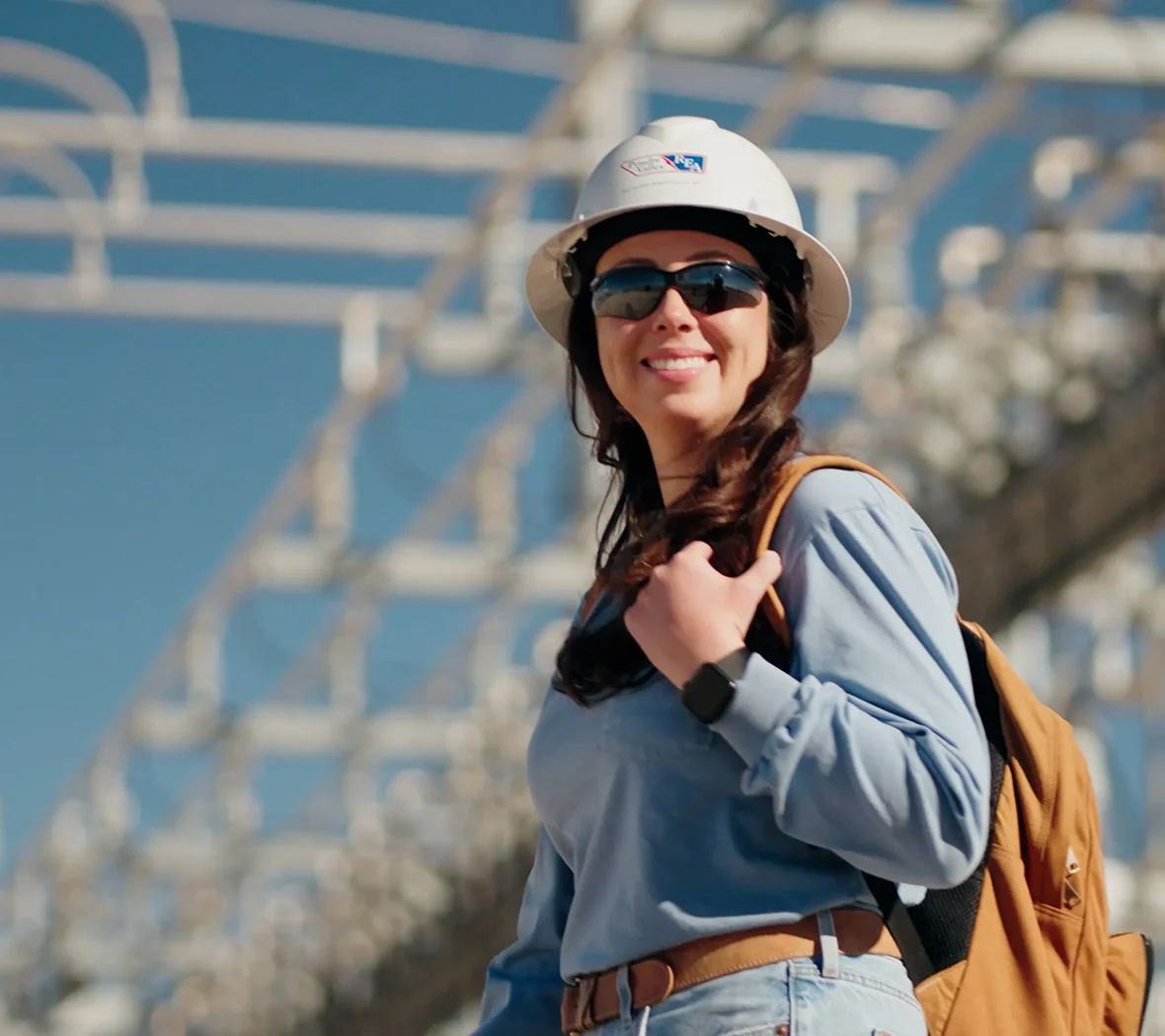 PVREA Employee standing in front of equipment