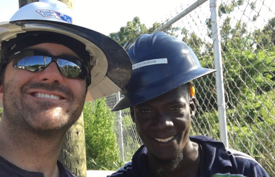 PVREA Lineman & Local Lineman From Haiti Pose Together For Selfie