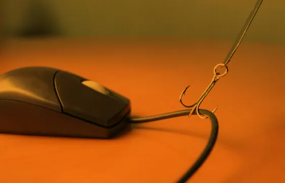 Cybersecurity Tips For A Safer Digital World - Computer mouse getting pulled by a fishing hook header image