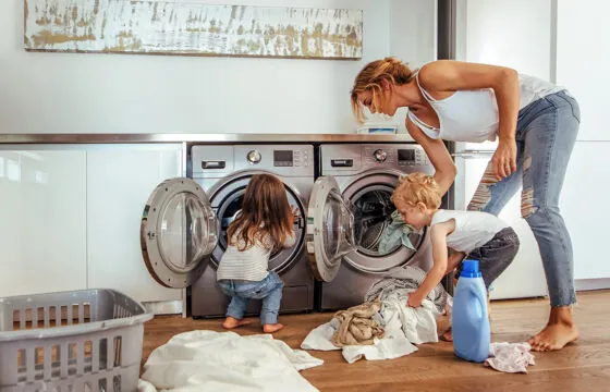 Energy Savings - Tips to beat the summer peak - family doing laundry