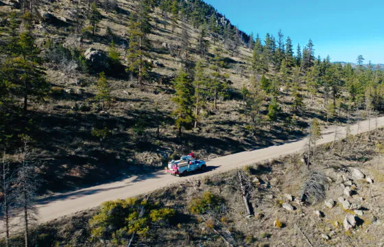 Scenic shot of a PVREA truck driving through the mountains.