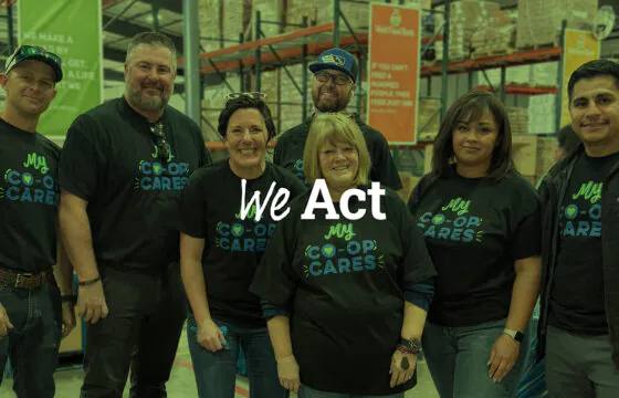 PVREA employees working at a local food bank with 'We Act' text overlay.